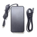 Black power adapter with cables on a white background