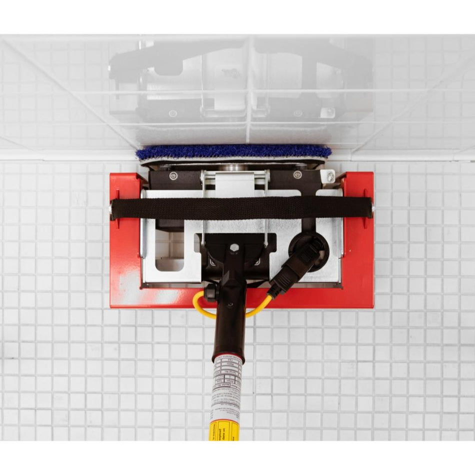 doodle-skate Cleaning tool with a brush and red base on a tiled wall