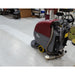 clean white floor Line that has been cleaned by the e20 floor scrubber in dirty work shop setting.