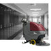 Grey Picture of school hallway with a the red and grey e20 sport floor scrubber showcased in front of the picture