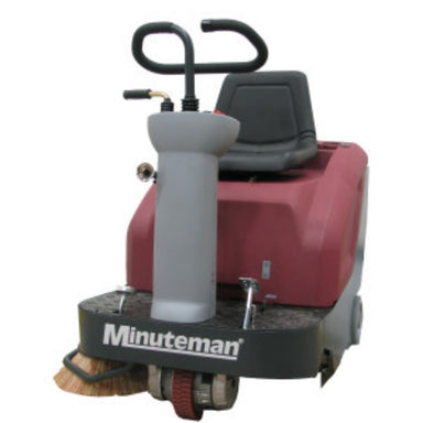 Front view of minute man kleen sweep 32R riding sweeper showing black seat with chrome foot controls and a grey steering console. 