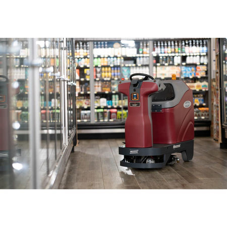 Minute man Max ride RoboScrub autonomous scrubber in the middle of a grocery store isle.