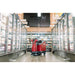 Minute man Autonomus RoboScrub in the middle of the well-lit freezer isle of a grocery store.