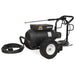 Black pressure washer with wheels and hose on a white background