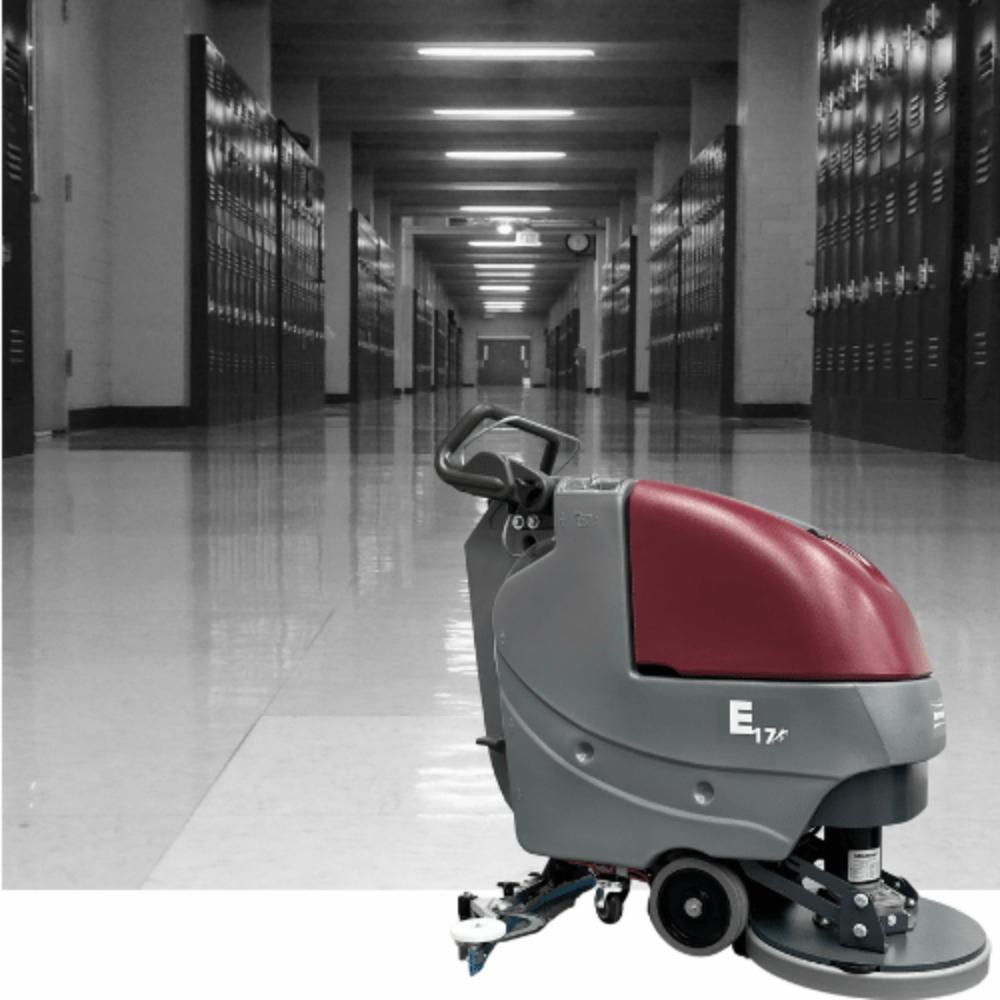 Grey school hallway with MinuteMan E17 Floor Scrubber in front of the picture. 