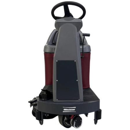 Front view highlighting grey steering column for minute man riding max ride 26 floor scrubber 