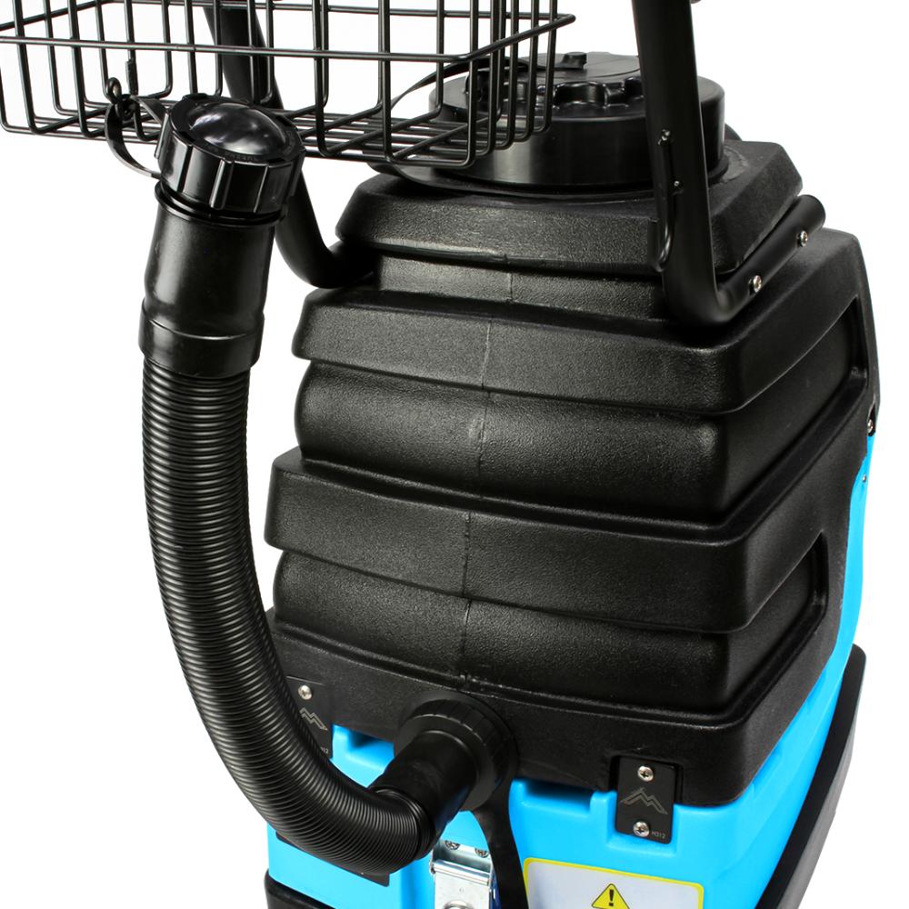 Close-up of a black and blue industrial vacuum cleaner on a white background