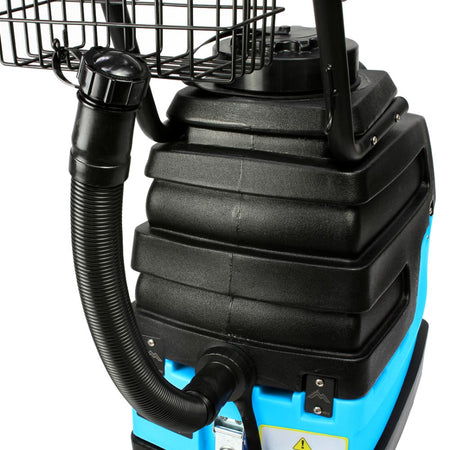 Close-up of a black and blue industrial vacuum cleaner on a white background