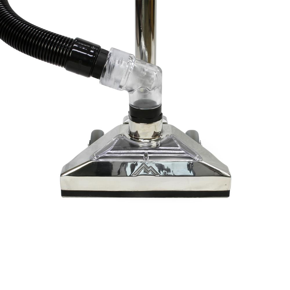 Close-up of a vacuum cleaner head with a black hose on a white background