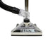 Close-up of a vacuum cleaner head with a black hose on a white background