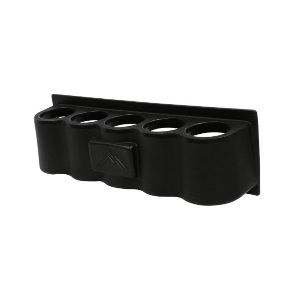 Black rubber duck holder with a central indentation on a white background