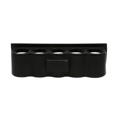 Black rubber mat with multiple circular holes on a white background