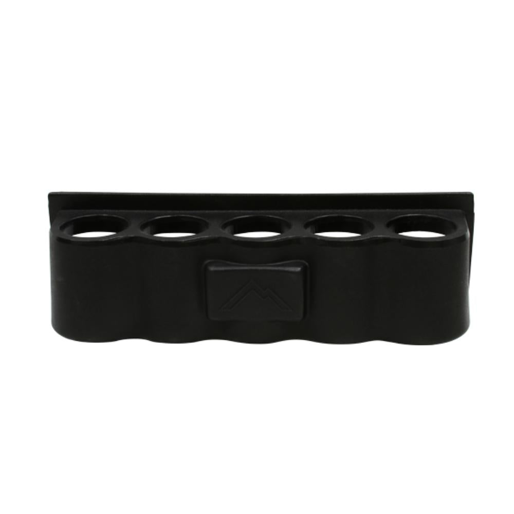 Black rubber mat with multiple circular holes on a white background