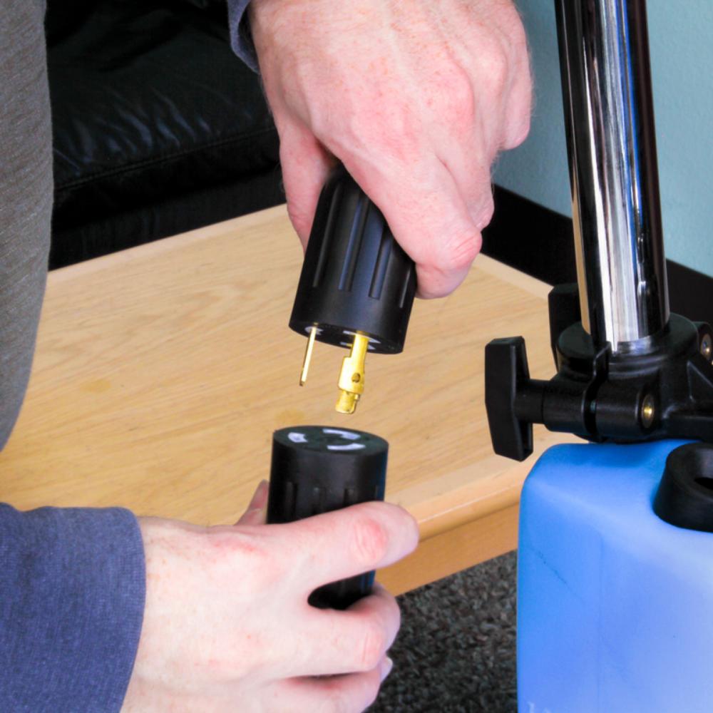 Person using a tire inflator to inflate a bicycle tire.