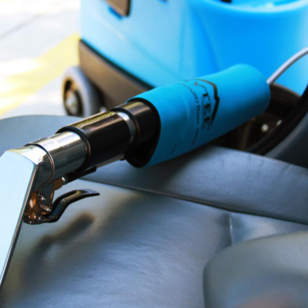 Close-up of a blue and silver tool on a metallic surface