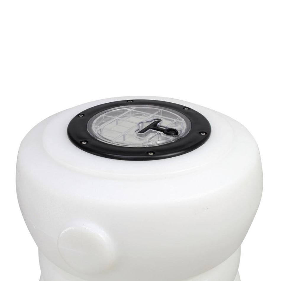 White cylindrical object with a black circular component on a white background