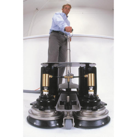 Person standing on a large Power Wand with multiple wheels and a transparent platform.