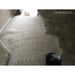 Carpet cleaning process with a cleaning machine on a beige carpet