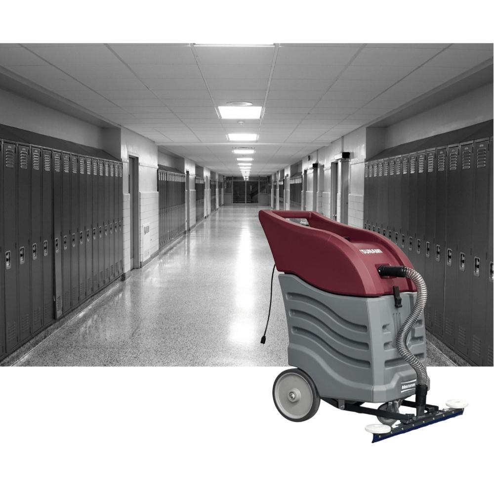 Picture of a grey school hallway with red and grey push squeegee vacuum in front. 