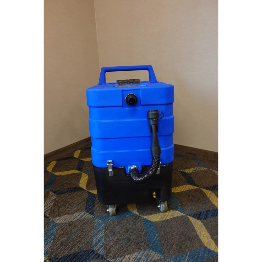 Blue and black U.S. Products Cobra 10.0 Carpet Extractor showing black drain hose with black vacuum connection port, and top switch board. 