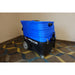 Blue top and black bottom Cobra 8.0 Carpet extractor being displayed on a multi patterned brown and yellow carpet 